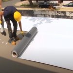 Kitchener Roofing workers flat roof on a commercial property