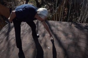 Kitchener Roofing Inspector inspecting nail sticking out on a roof.